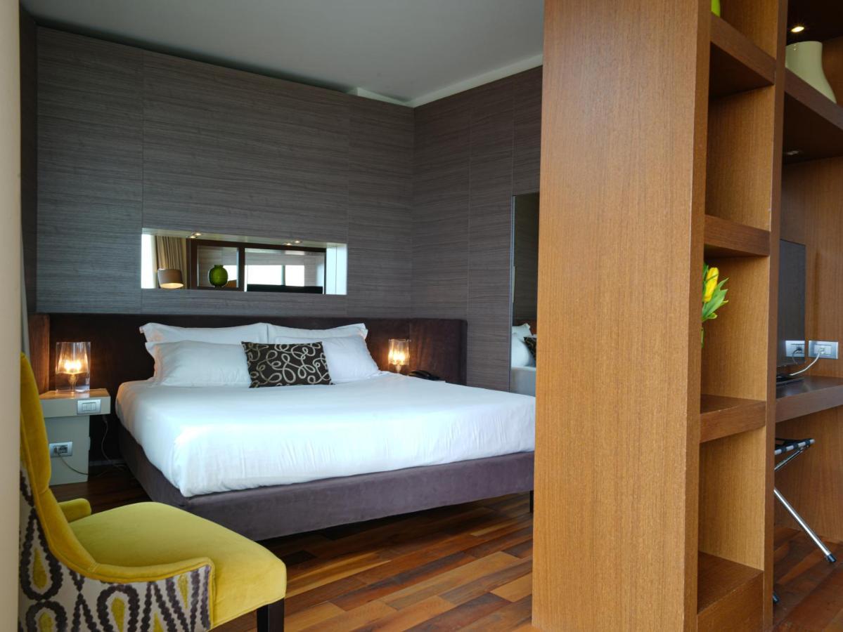 Pisa Tower Plaza Hotel Luaran gambar A bedroom at the hotel